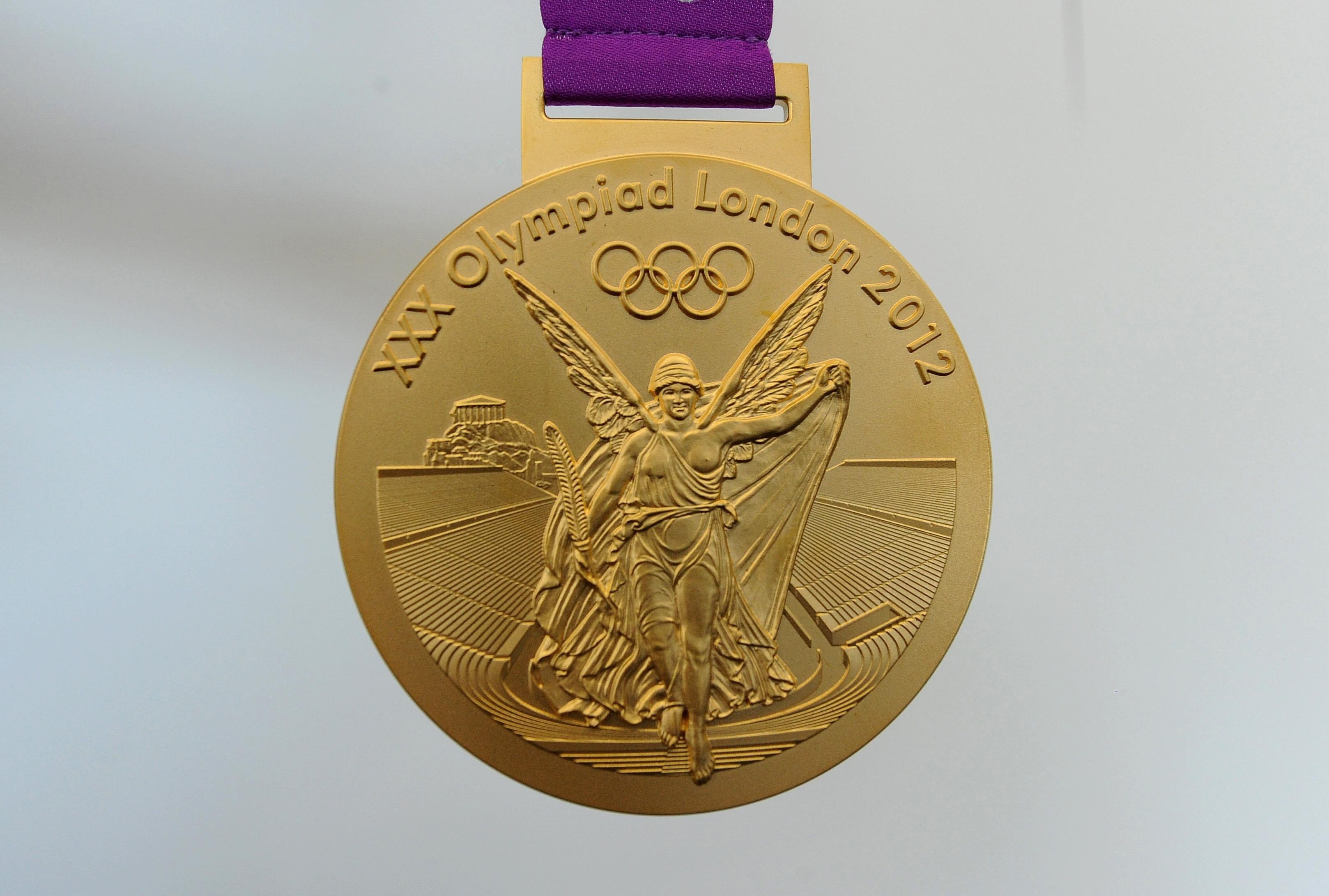 Золотая медаль Олимпийских игр Лондон 2012. Олимпийская Золотая медаль Лондон. Медали олимпиады 2012 Лондон. Олимпийский медаль золото 2012.